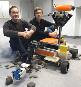 Explorer robot with Jörg Stückler (left) and Max Schwarz (right)