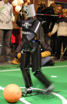 NimbRo TeenSize Soccer robot Robotinho kicking at the Science Days 2006